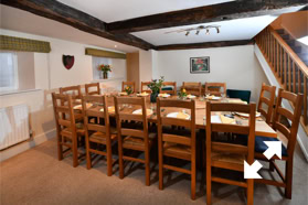 The dining room, with stairs going up to some of the bedrooms